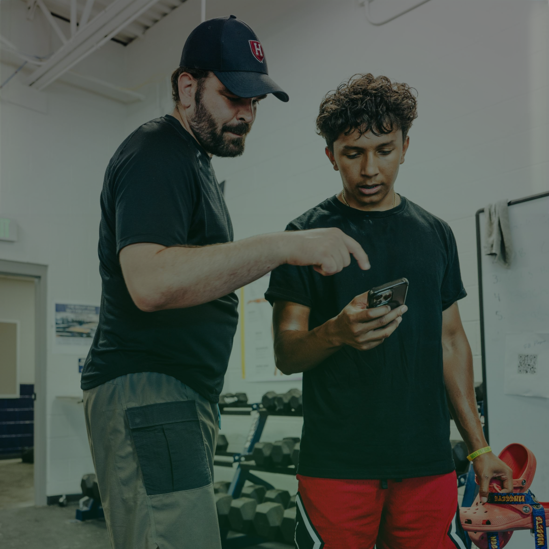 Coach and athlete reviewing training information together